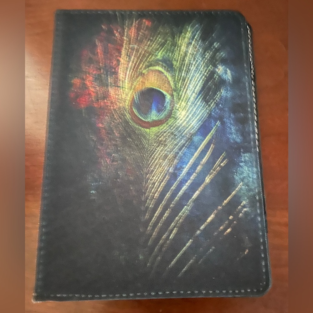 Caseable Tablet case cover 7” with peacock feather motif. Excellent pre used